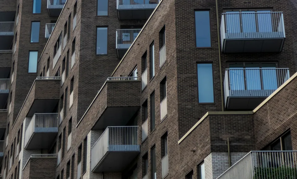 Close view of brick apartment buildings and projecting balconies in London