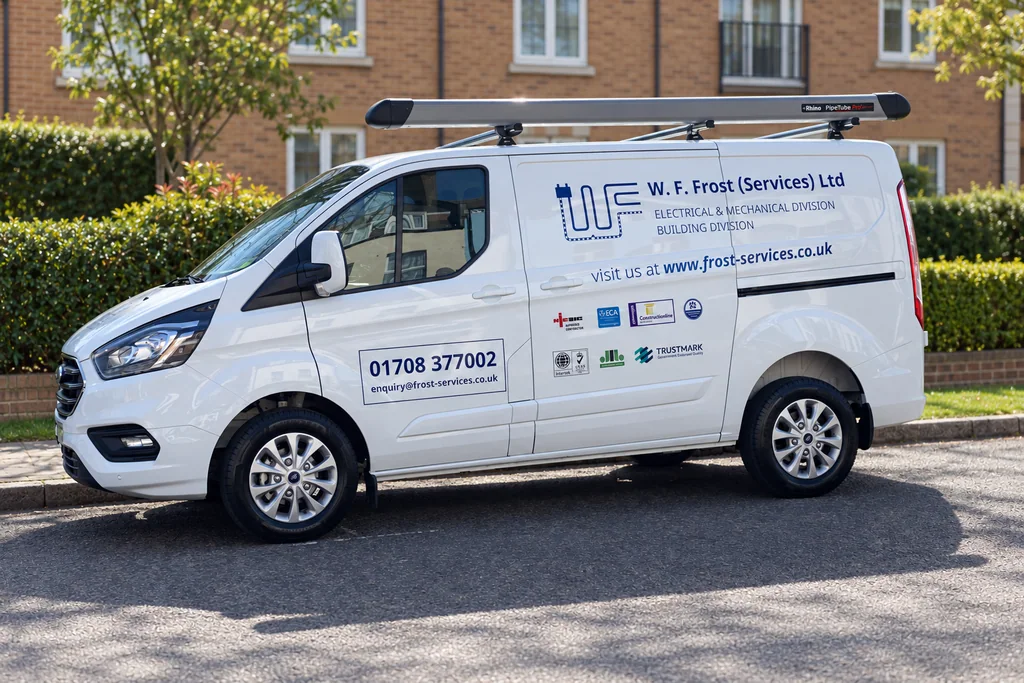 Frost Services van with blue company signwriting; residential background digitally replaced